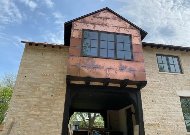 Copper metal panel facade on a stone building for Metal Roof Coating in Ocean Pines