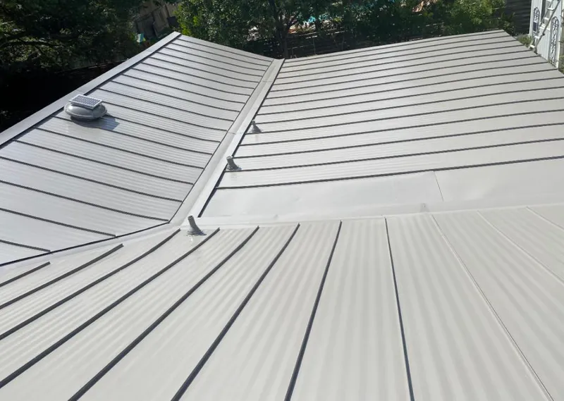 Solar attic fan installed on a metal roof for Roof Ventilation in Ocean Pines